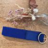 Ceinture bleue élastique à boucle dorée